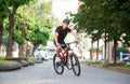 Cyclist riding along empty city streets Royalty Free Stock Photo