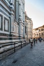 Cyclist riding besides Cathedral of Florence