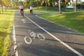 Cyclist riding bicycle on bike lane