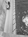 Cyclist riding a bicycle on the bike path beside the river. top view