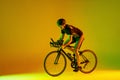 Cyclist riding a bicycle  against neon background Royalty Free Stock Photo