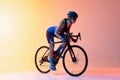 Cyclist riding a bicycle isolated against neon background Royalty Free Stock Photo