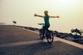Cyclist riding bike with arms outstretched Royalty Free Stock Photo