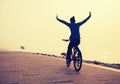 Cyclist riding bike with arms outstretched Royalty Free Stock Photo
