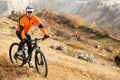 Cyclist Riding the Bike on the Beautiful Spring Mountain Trail