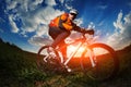 Cyclist riding bike on a nature trail in the mountains. Royalty Free Stock Photo