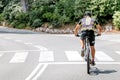 Cyclist riding a bike on an open road Royalty Free Stock Photo