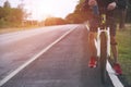 Cyclist riding a bike on an open road to the sunset Royalty Free Stock Photo