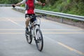 Cyclist riding bike with outstretched arms on road Royalty Free Stock Photo
