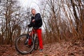 Cyclist Riding the Bike on the Trail in the Beautiful Spring Forest Wide Angle Royalty Free Stock Photo