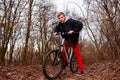 Cyclist Riding the Bike on the Trail in the Beautiful Spring Forest Wide Angle Royalty Free Stock Photo