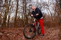 Cyclist Riding the Bike on the Trail in the Beautiful Spring Forest Wide Angle Royalty Free Stock Photo