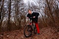 Cyclist Riding the Bike on the Trail in the Beautiful Spring Forest Wide Angle Royalty Free Stock Photo