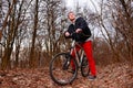 Cyclist Riding the Bike on the Trail in the Beautiful Spring Forest Wide Angle Royalty Free Stock Photo