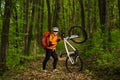 Cyclist Riding the Bike on a Trail in Summer Forest Royalty Free Stock Photo