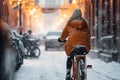 Cyclist riding through city streets at snowy winter day. Generative AI