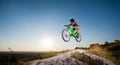 Cyclist riding downhill on mountain bike on the hill Royalty Free Stock Photo