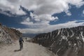 Cyclist riding in Khardungla Pass on Leh Nubra Road