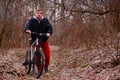 Cyclist riding a mountain bike along the forest road Royalty Free Stock Photo