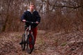 Cyclist riding a mountain bike along the forest road Royalty Free Stock Photo