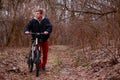 Cyclist riding a mountain bike along the forest road Royalty Free Stock Photo