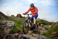 Cyclist Riding Mountain Bike on the Beautiful Spring Rocky Trail. Extreme Sport Concept Royalty Free Stock Photo