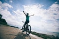 Cyclist riding Mountain Bike on sunrise seaside Royalty Free Stock Photo