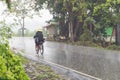 Cyclist on the road in the rain