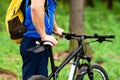 Cyclist in spring park with bicycle Royalty Free Stock Photo