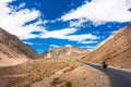 Cyclist standing on mountains road. Himalayas