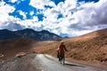 Cyclist standing on mountains road. Himalayas