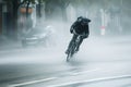 cyclist struggling against powerful wind gusts on street Royalty Free Stock Photo