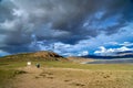 Cyclist among stunning Tibeten landscape Royalty Free Stock Photo