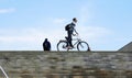Cyclist at the top of the stairs