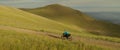 The cyclist traveling around the world. The woman is ride on bike with bikepacking bags. Live handheld camera. Concept Royalty Free Stock Photo