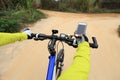 Cyclist use smartphone for navigator when riding Royalty Free Stock Photo