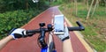 Cyclist using smartphone for navigation when riding Royalty Free Stock Photo