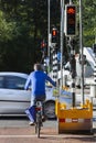 Cyclist waiting for red light of a temporary traffic light