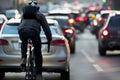 cyclist weaving through gridlocked city cars