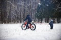 Cyclist in winter on a bicycle with very wide wheels 2018