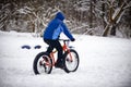 Cyclist in winter on a bicycle with very wide wheels 2018