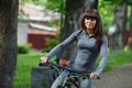 Cyclist woman riding a bicycle in park Royalty Free Stock Photo