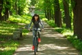 Cyclist woman riding a bicycle in park Royalty Free Stock Photo