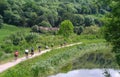 Cyclists along a canal Royalty Free Stock Photo