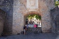 Cyclists arriving through the medieval French Gate, Pamplona