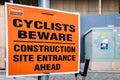 Cyclists Beware - Construction site entrance ahead - on a street sign