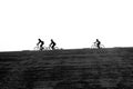 Cyclists biking on the Brouwersdam, the seventh structure of the Delta Works.