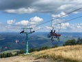 Cyclists on a cable car. Funicular to the top of Carpathians Gimba Mountain