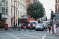 Cyclists, cars and buses waiting for green light on Oxford Street, London, UK. Royalty Free Stock Photo