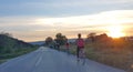 Cyclists cycling in the nature by the trees in spring